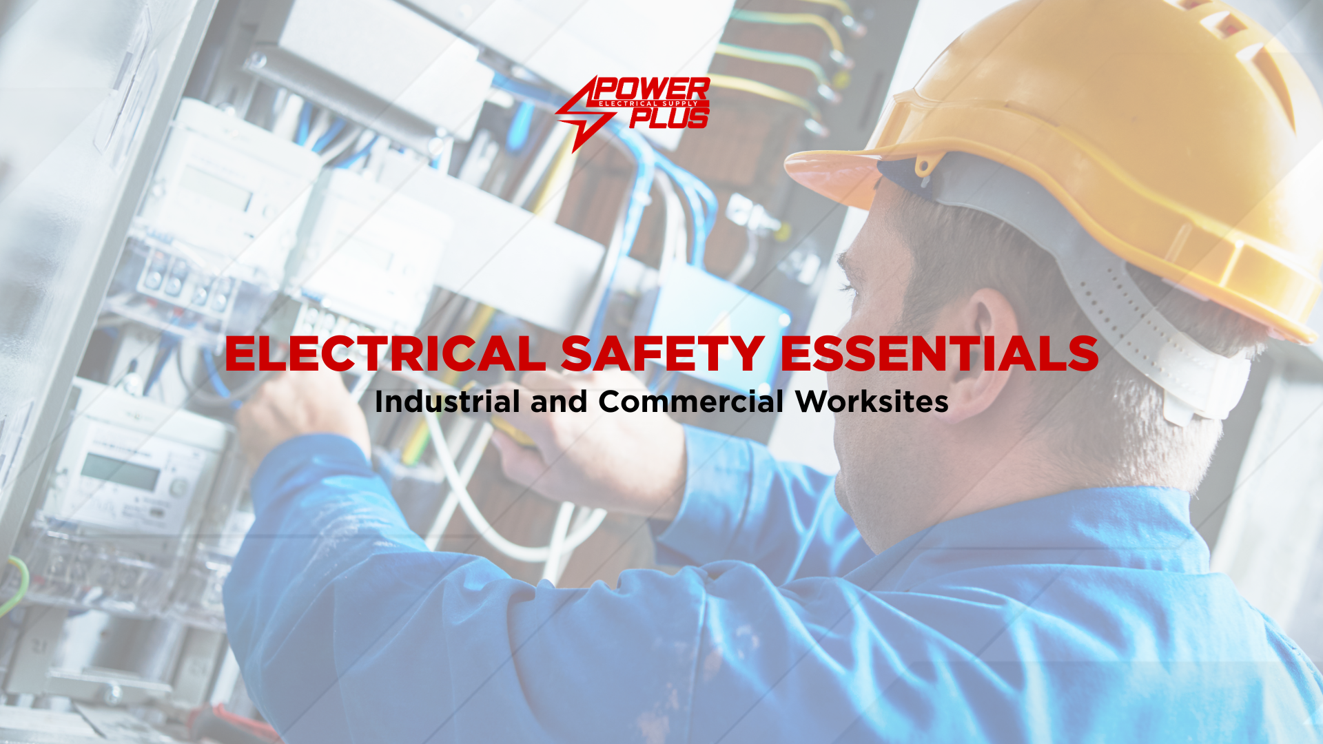 Electrician wearing a safety helmet working on an electrical control panel in an industrial worksite, highlighting electrical safety essentials.