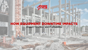 Construction site with structural framework and crane, illustrating how equipment downtime affects project timelines and overall profitability.