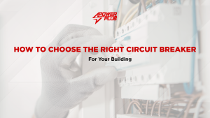 Technician installing or inspecting a circuit breaker panel to ensure electrical safety in a building.