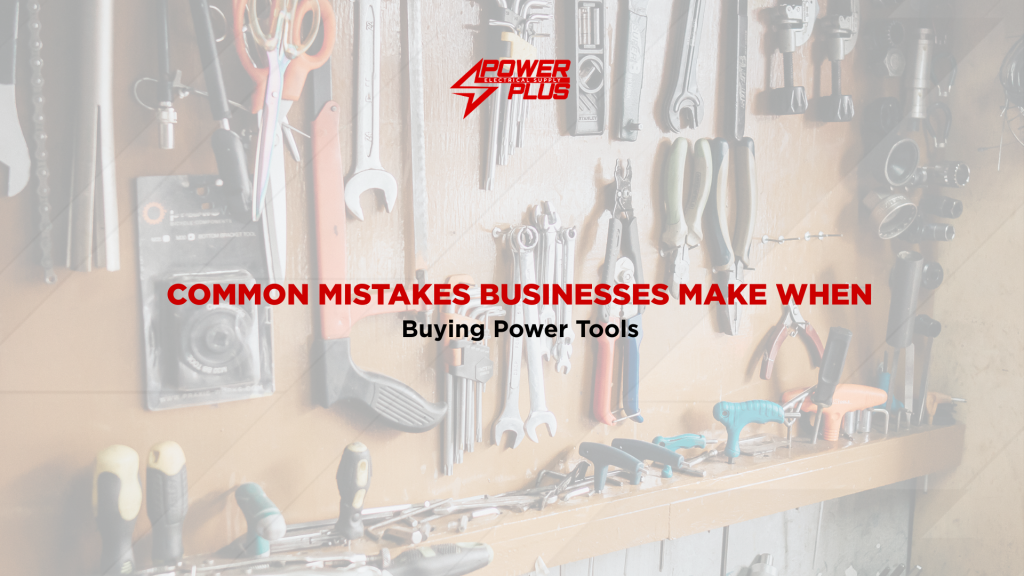 Collection of industrial hand tools and power tools displayed on a workshop wall for commercial and construction use.